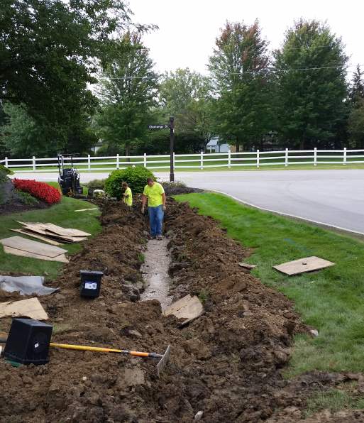 Working to remove an unsightly ditch