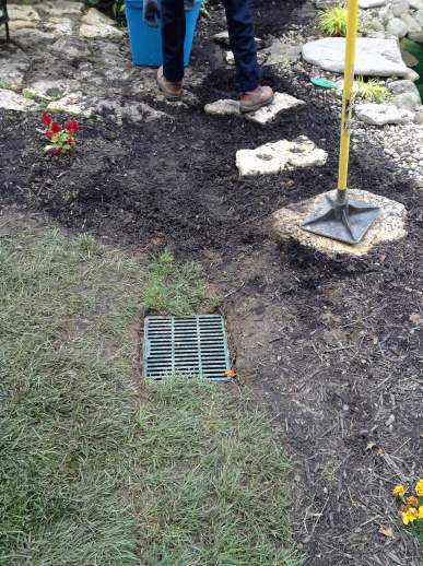 New drain blends in to the yard and is beautiful while still functional