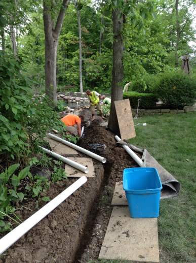New drainage borders existing landscape so as not to disturb the lawn