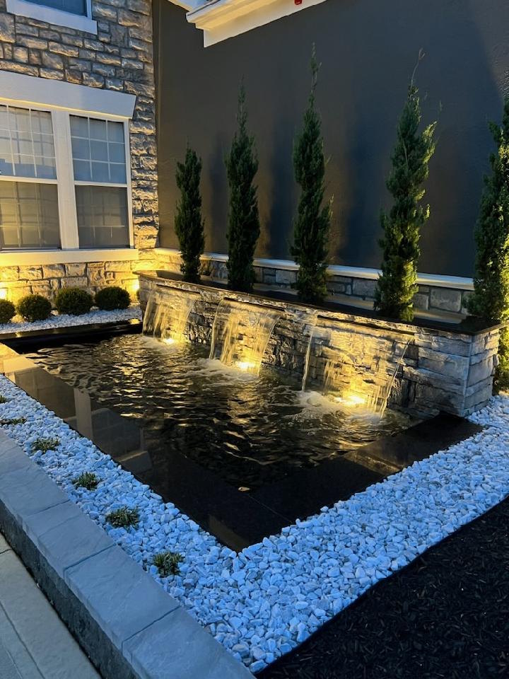lighted fish pond with waterfall