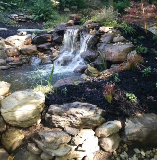 Beautiful landscaping with integrated waterfall